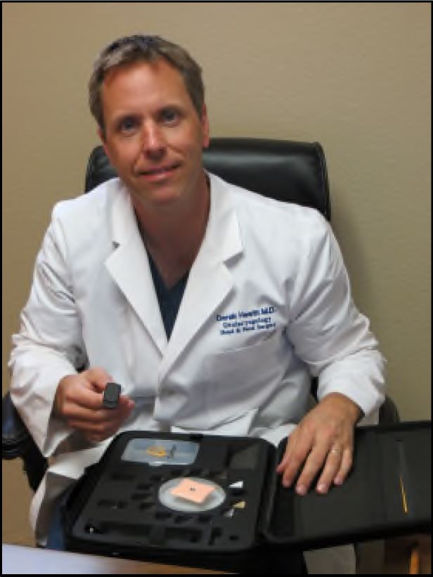 Dr. Hewett displays the tools used by BAHA implants